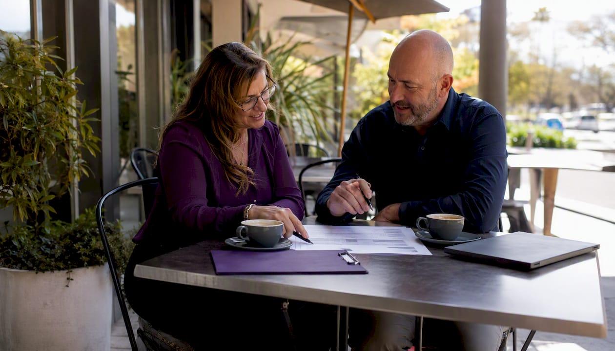 HR manager and coordinator reviewing work plan